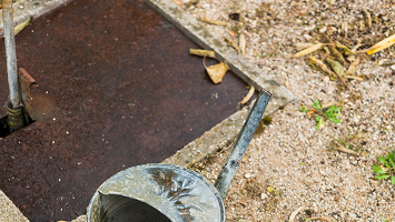 Brown round septic tank cover at ground level